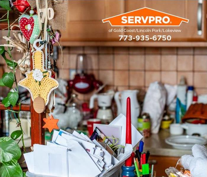 The kitchen of a person with a hoarding disorder is shown.