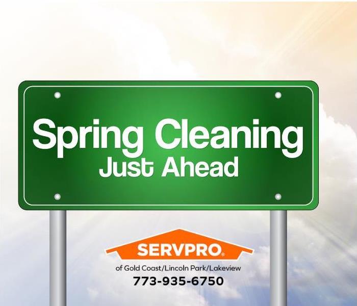 A sign reading, “Spring Cleaning Just Ahead,” is shown.